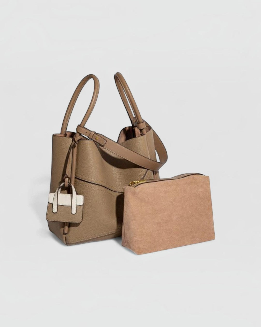 Pine Drew India Becca tote bag in taupe vegan leather with gold hardware and a matching suede-textured pouch
