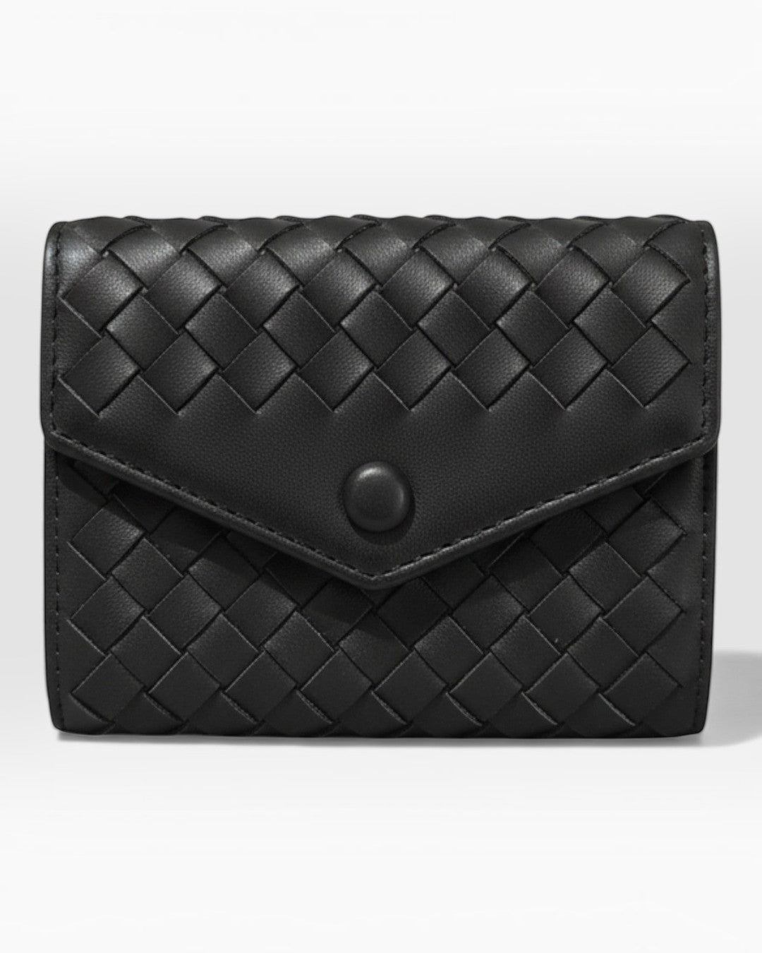 Pine Drew India Caden Interlace black leather card holder with a woven geometric pattern and matte snap closure.