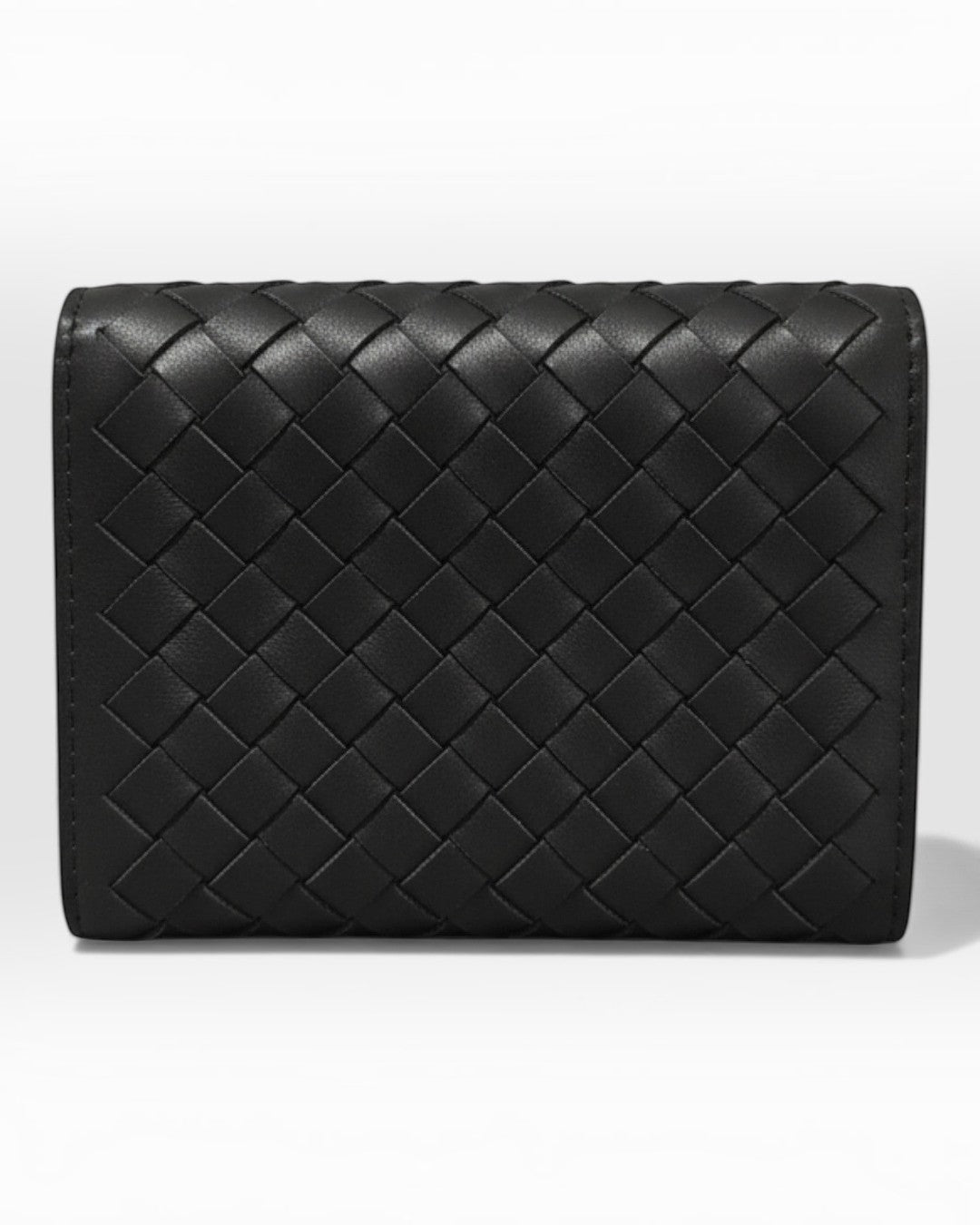 Pine Drew India Caden Interlace card holder in premium black leather with a structured, woven geometric design.