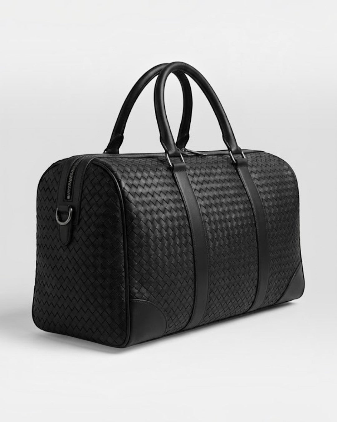 Pine Drew India Elora black vegan leather duffle bag with signature woven detailing and reinforced handles