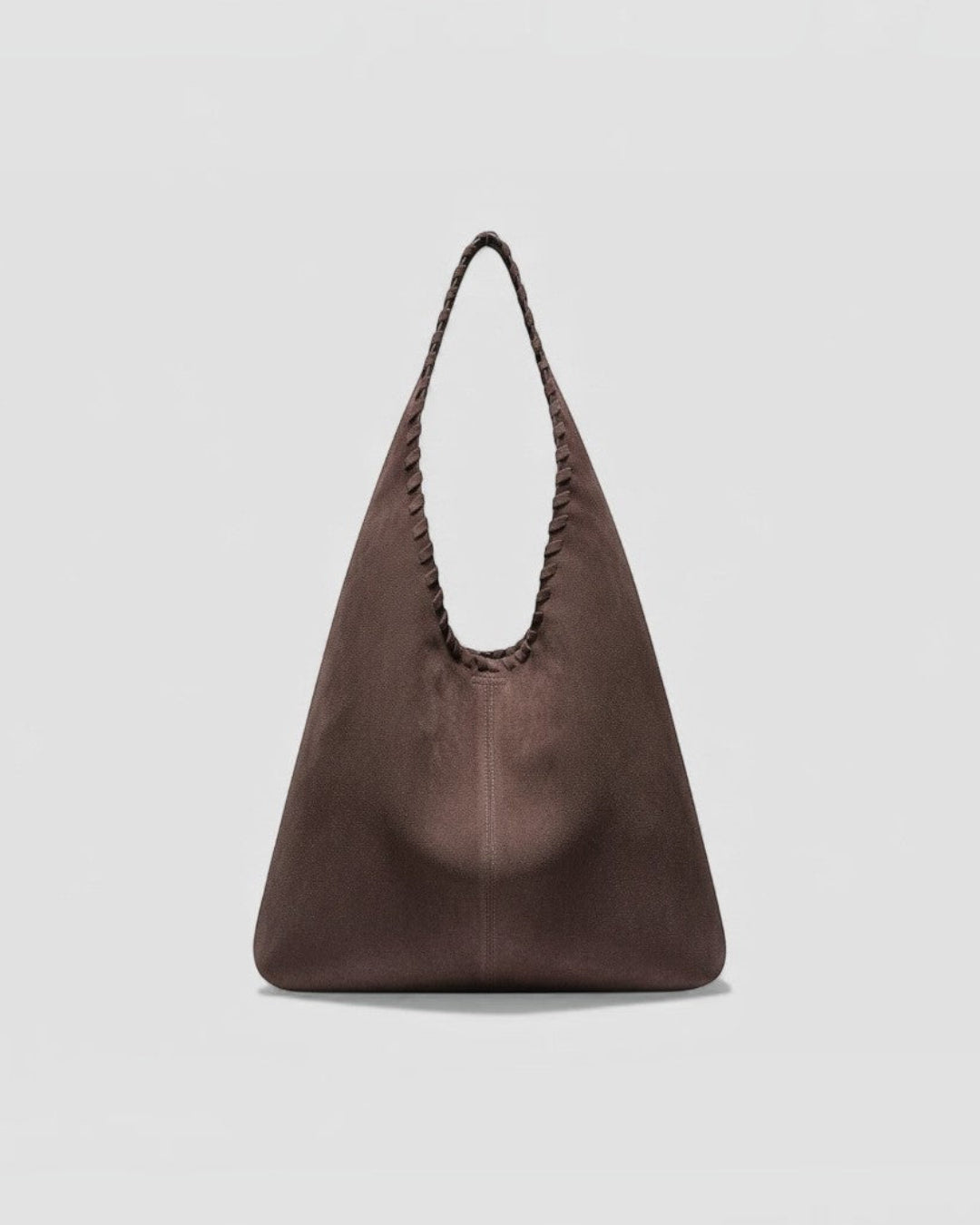 Pine Drew India Arista brown suede leather hobo tote bag with a signature hand-braided handle and architectural shape.