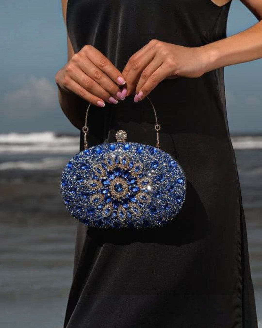 Pine Drew India Colette clutch bag featuring blue diamond-encrusted floral patterns on a polyester evening accessory.