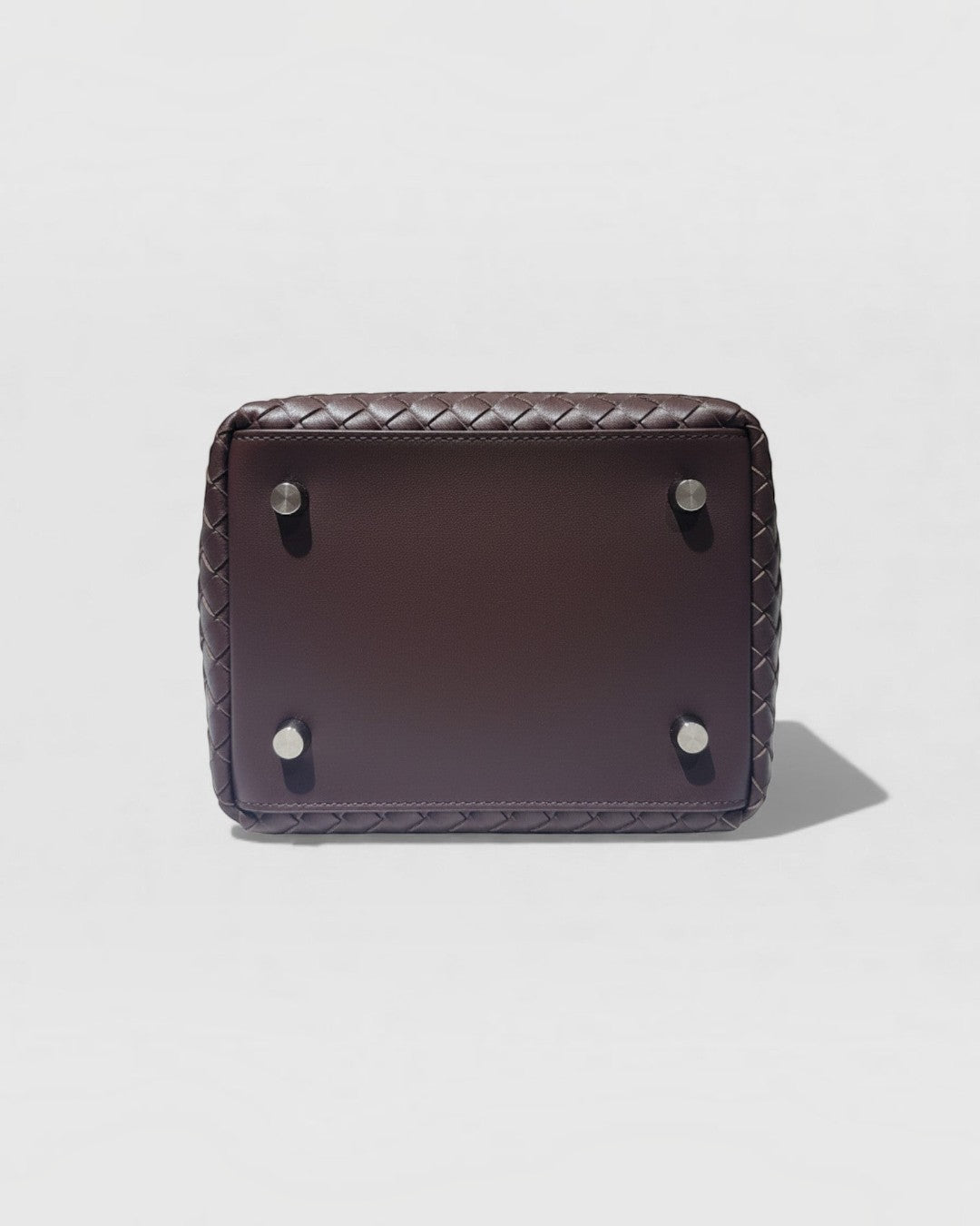 Pine Drew India Luna handbag base in espresso brown full-grain leather with four silver protective feet.