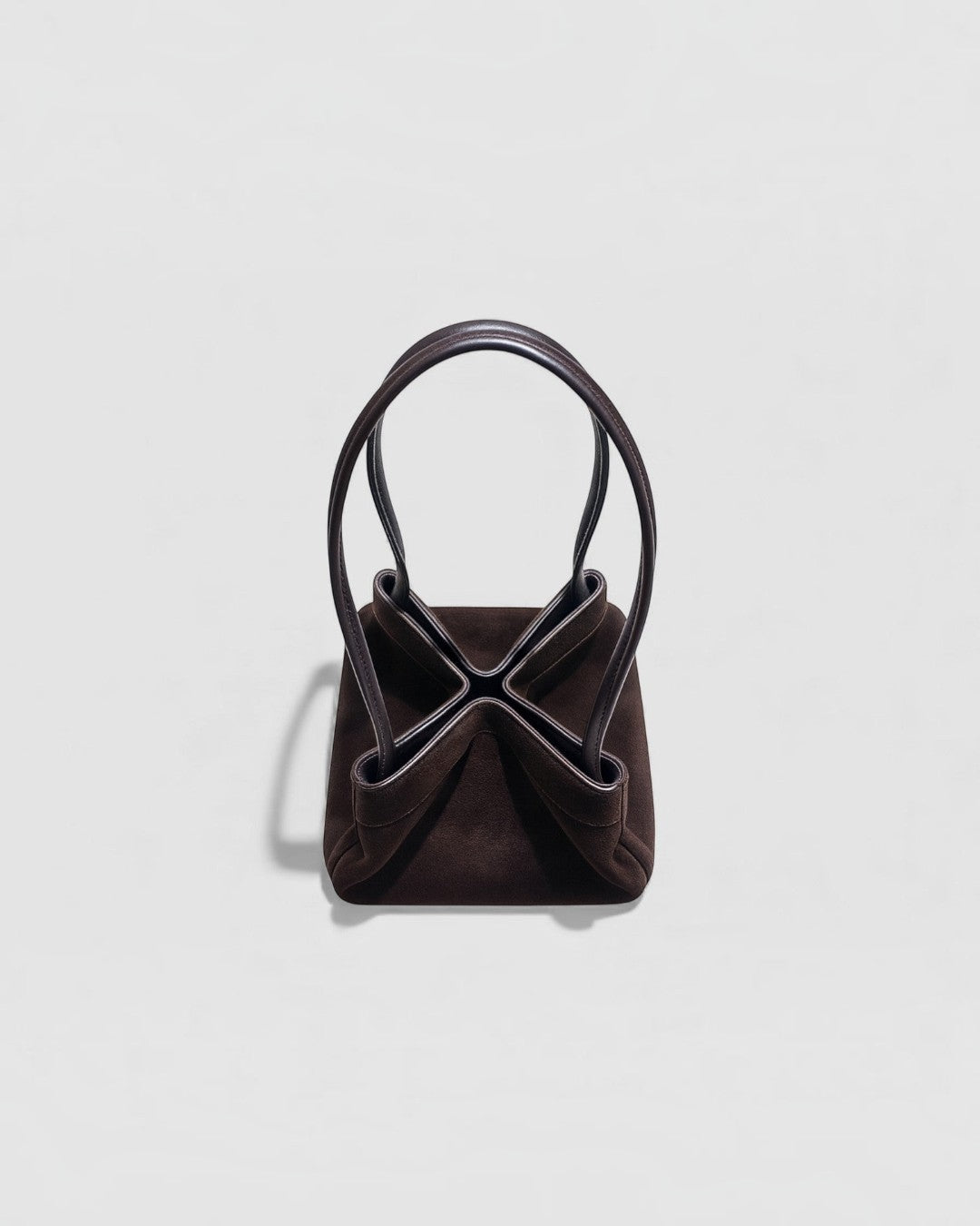 Pine Drew India Luna Umber handbag in suede-textured brown leather with sculptural architectural arc handles.