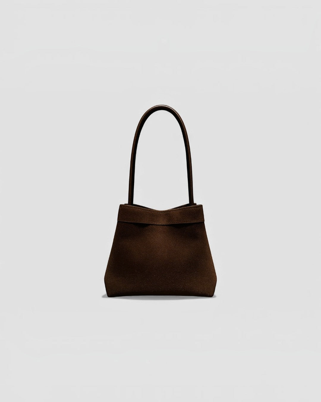 Pine Drew India Luna Umber handbag in brown suede-textured leather with architectural arc handles and structured shape.