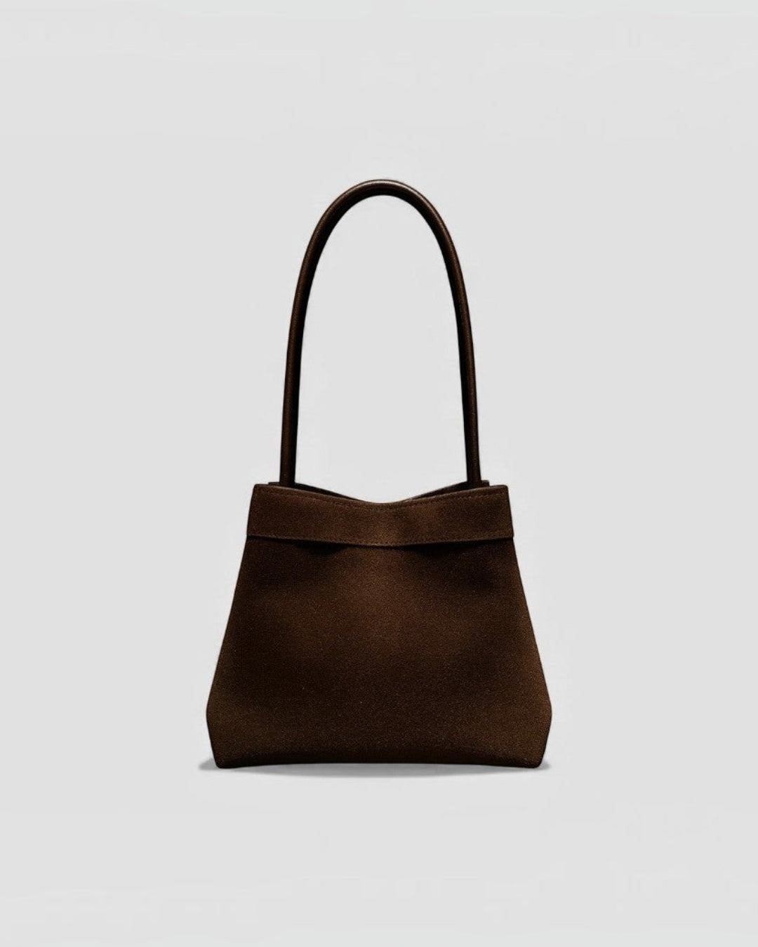 Pine Drew India Luna Umber handbag in brown suede-textured leather with architectural arc handles and structured shape.