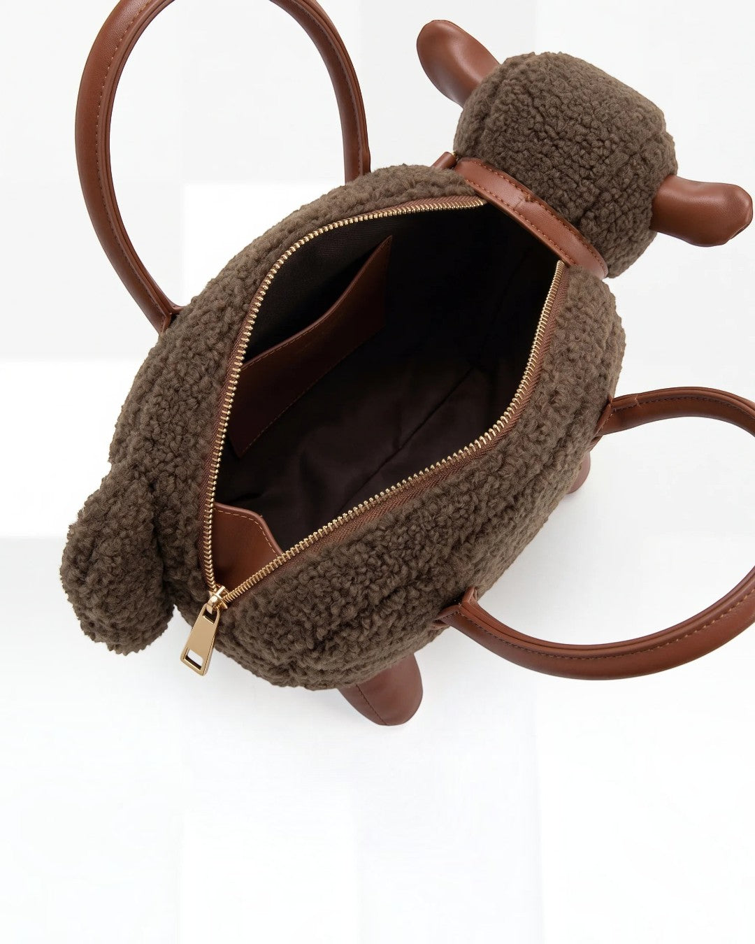 Pine Drew India Montone Mini sheep-shaped bag in chocolate teddy shearling vegan leather with gold hardware.