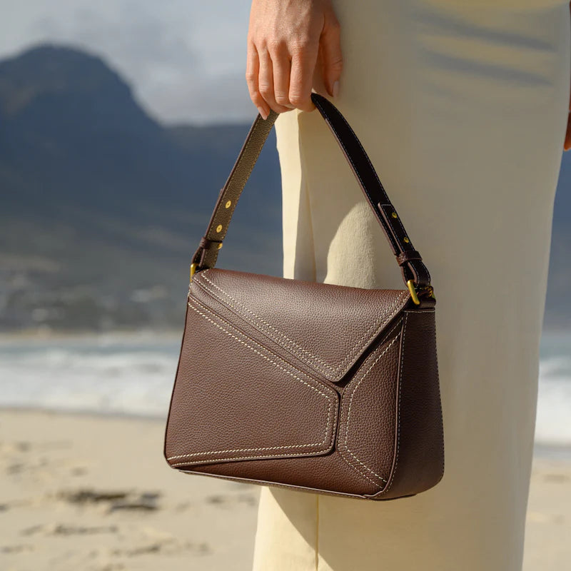 The Lotus Leather Sling Handbag in Pure Leather