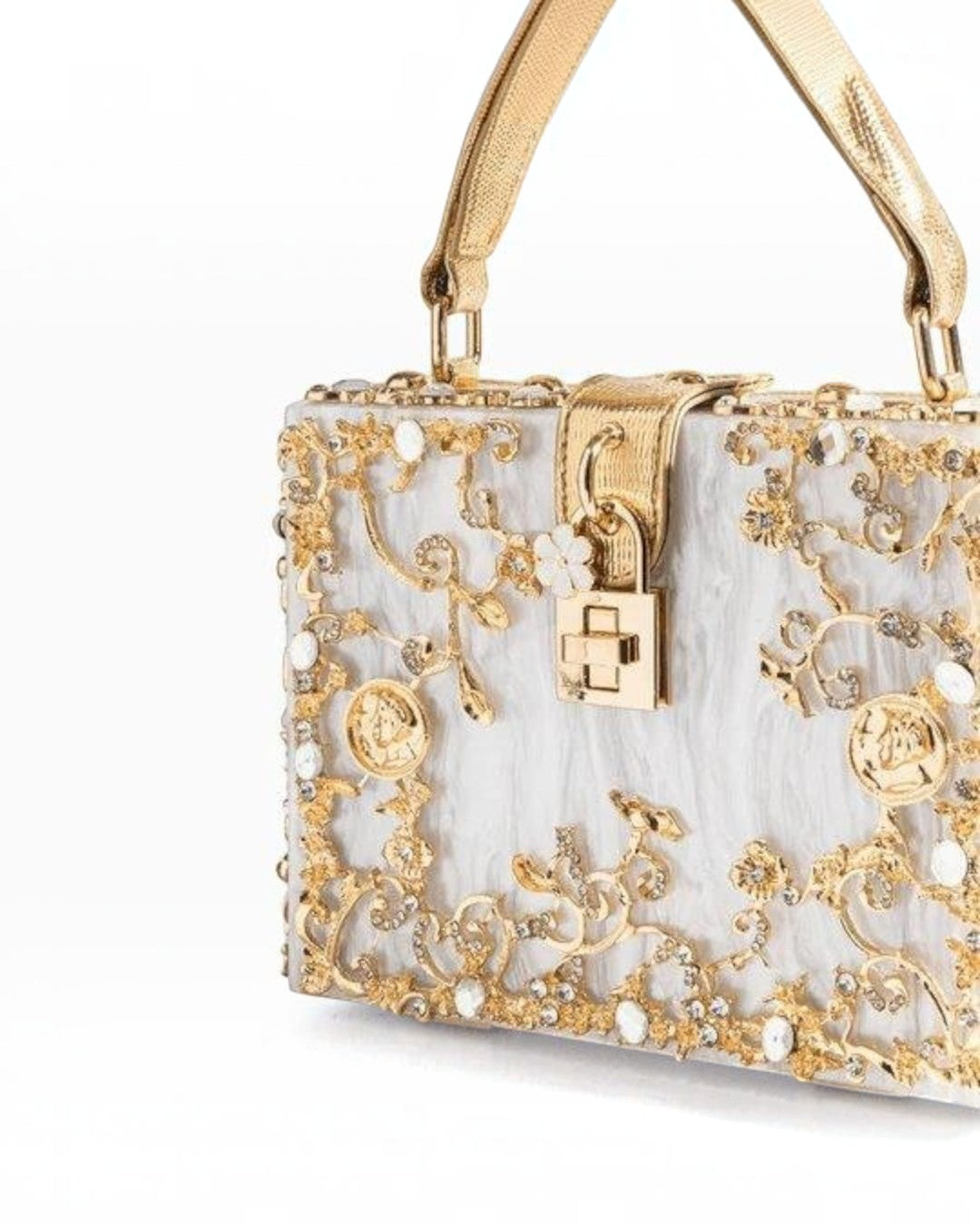 Pine Drew India Bella Box handbag in white acrylic with intricate gold-plated floral filigree and a turn-up lock.