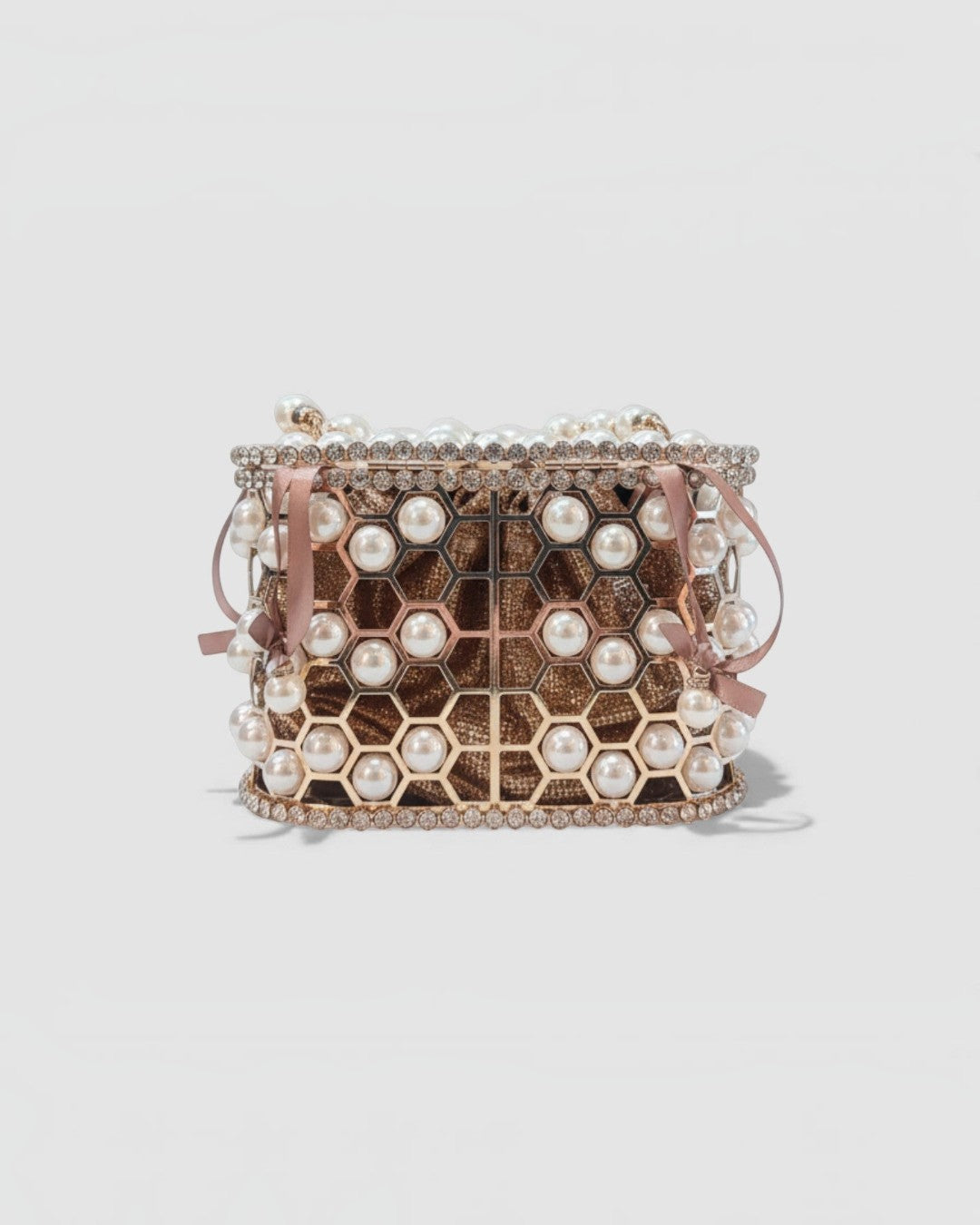 Pine Drew India Aurelia Pearl Lattice minaudière featuring a champagne-gold honeycomb frame with inset luminous pearls.