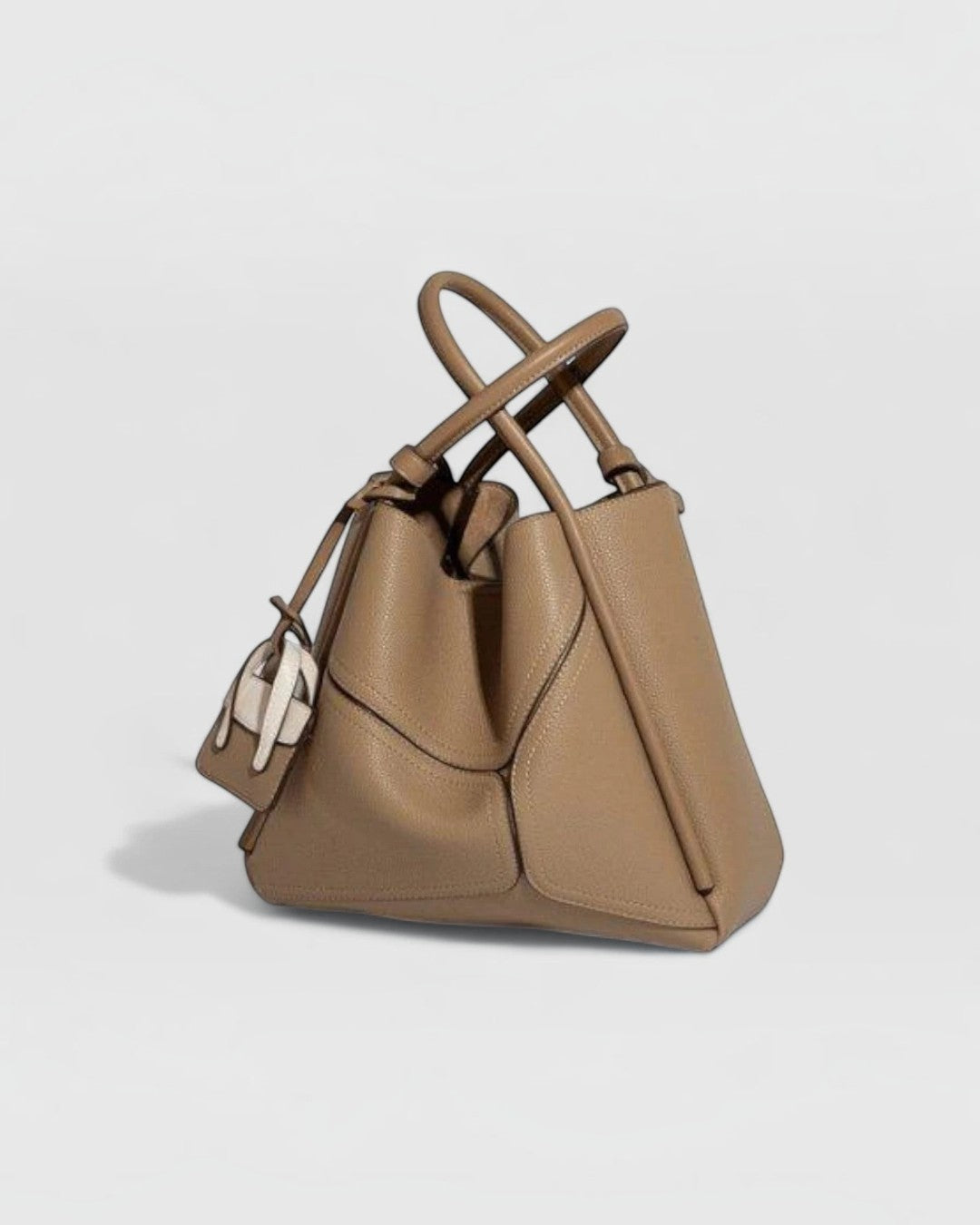 Pine Drew India Becca tote bag in tan vegan leather with gold hardware and a detachable shoulder strap.