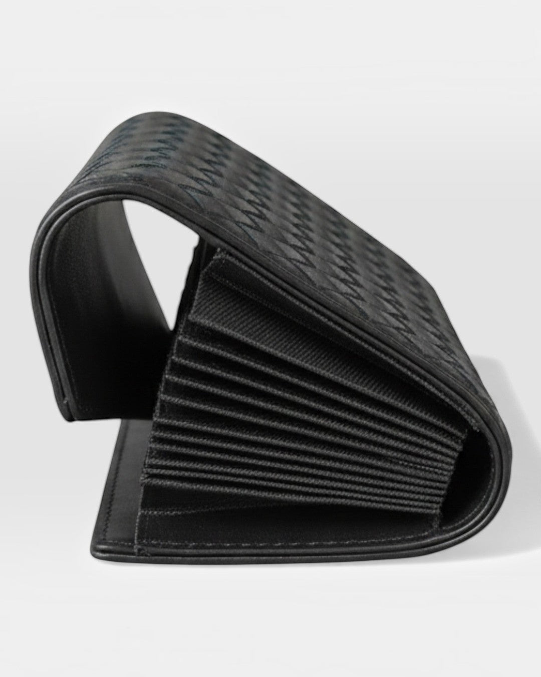 Pine Drew India Caden Interlace black leather card holder with an accordion-style interior and snap closure.