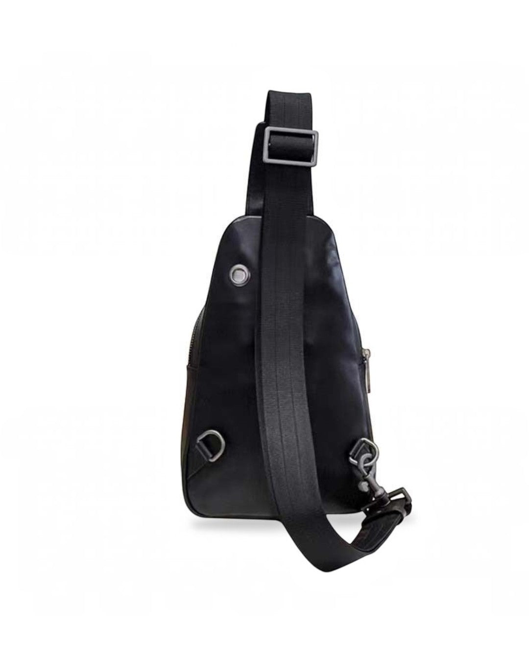 Pine Drew India Woven Voyager black leather sling bag, back view showing adjustable strap and metal hardware.