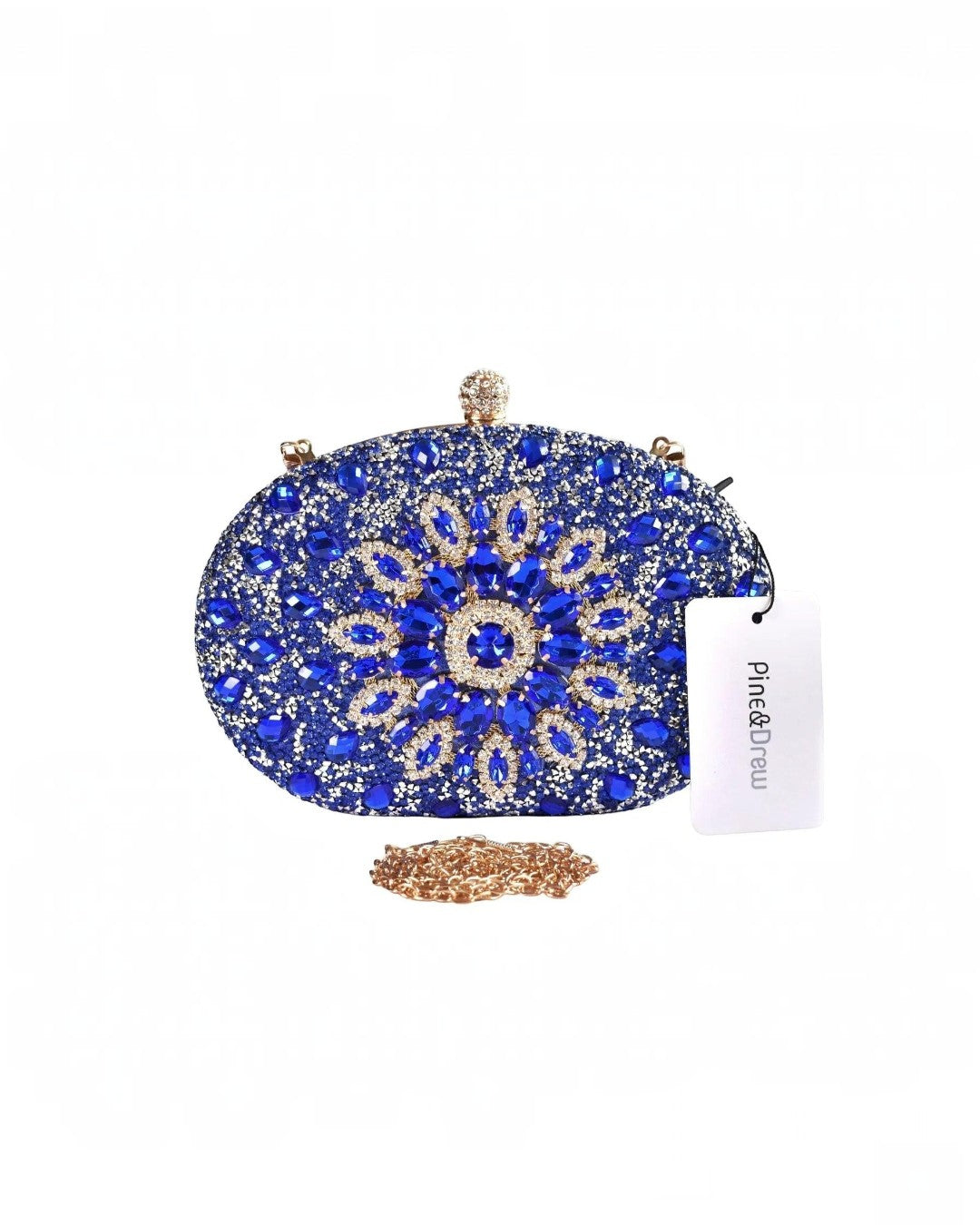 Pine Drew India Colette clutch bag in royal blue with intricate diamond-encrusted floral patterns and gold chain strap.