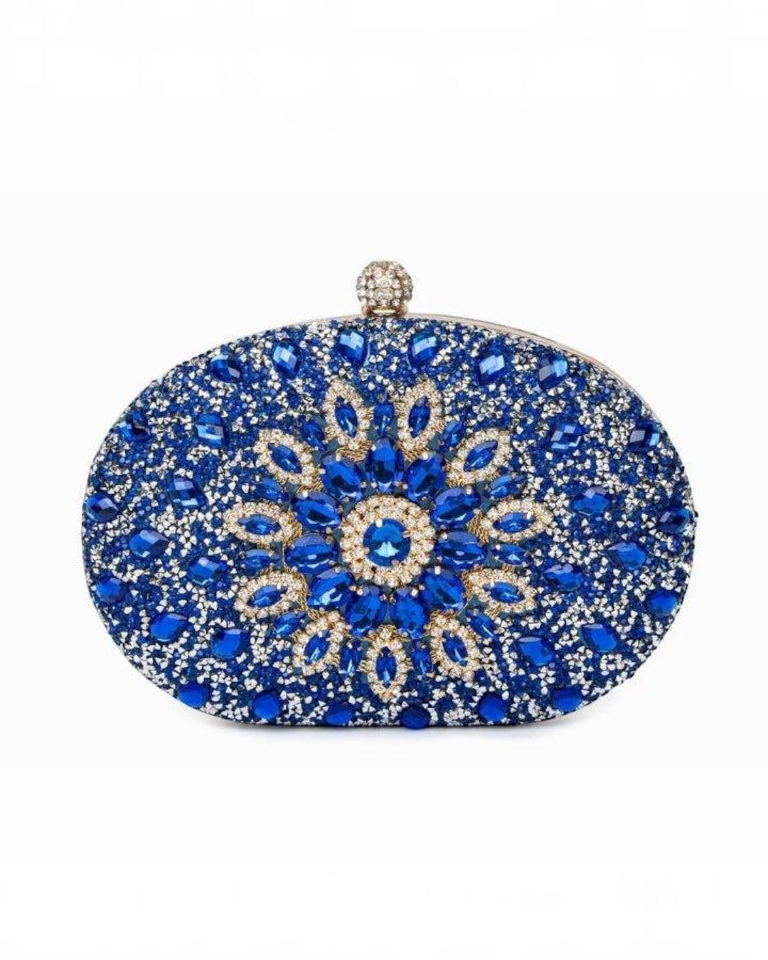 Pine Drew India Colette clutch bag in royal blue with intricate diamond-encrusted floral patterns and a clasp closure.