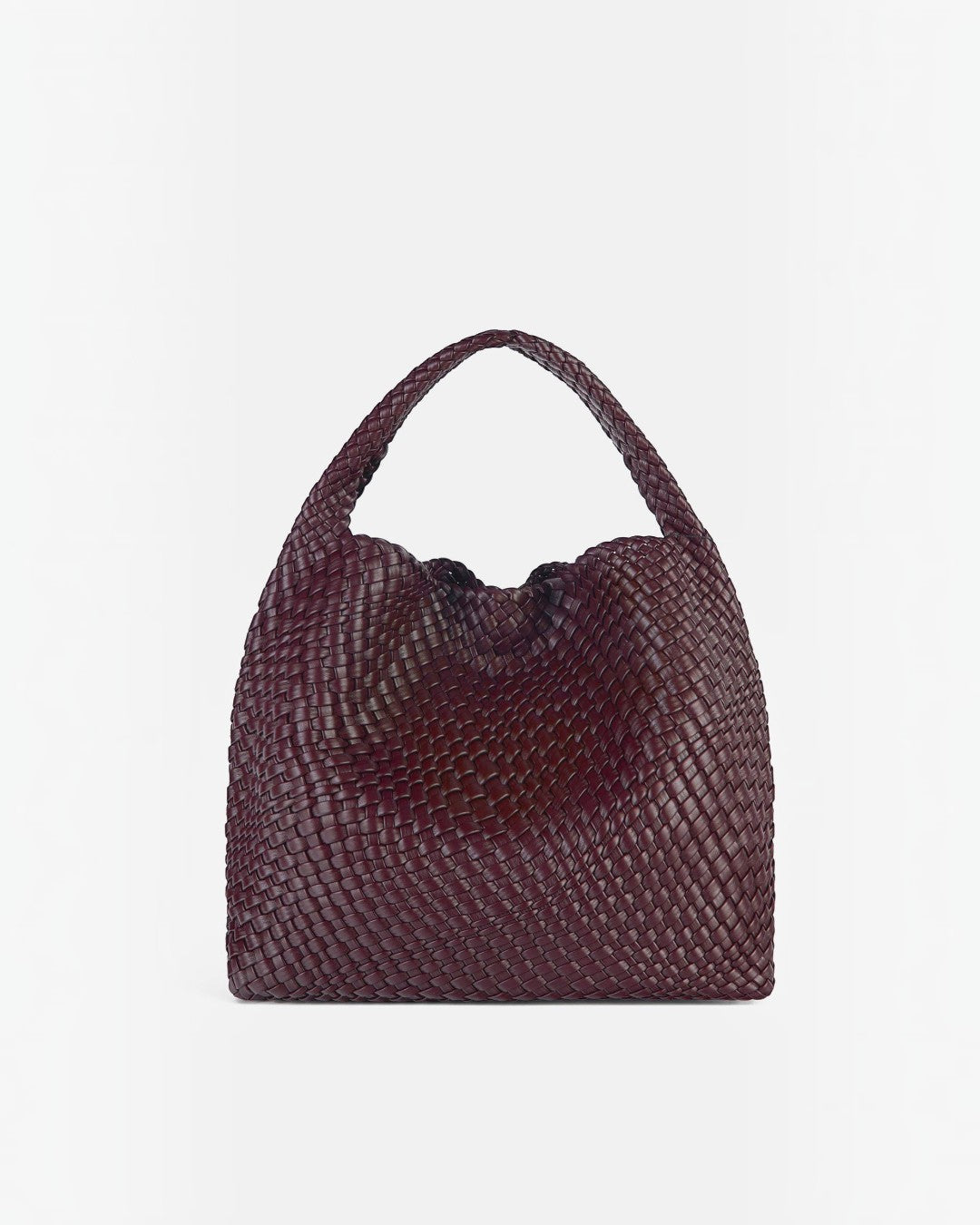 Pine Drew India The Jocelyn bag in deep burgundy handwoven vegan leather with a slouchy sculptural silhouette.