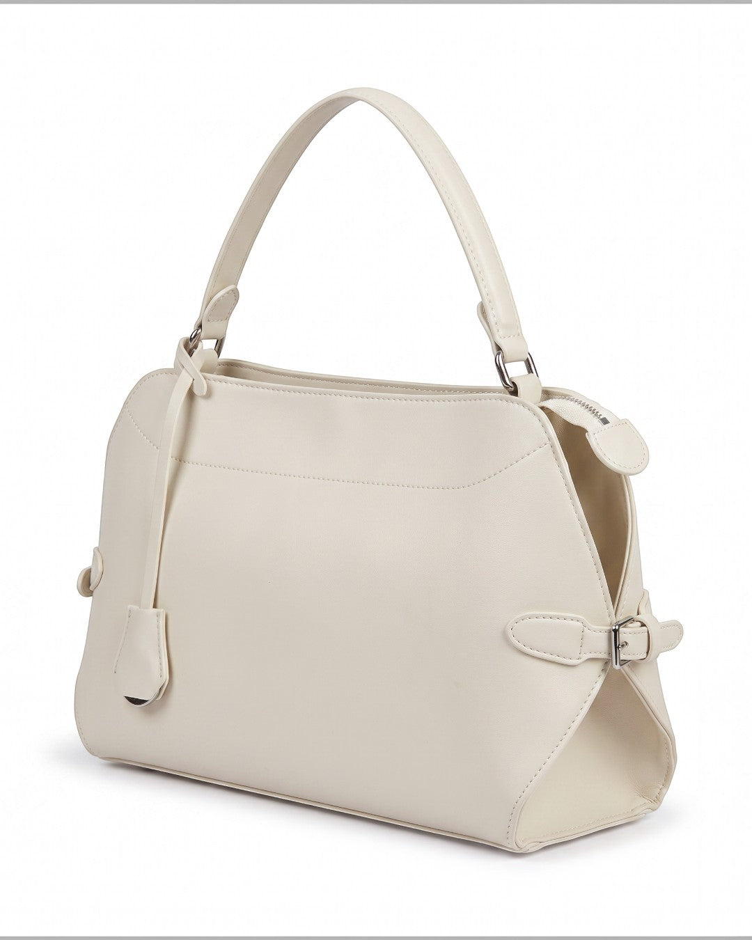 Pine Drew India Celeste hobo bag in cream leather with a top handle, gold hardware, and side buckle detail.