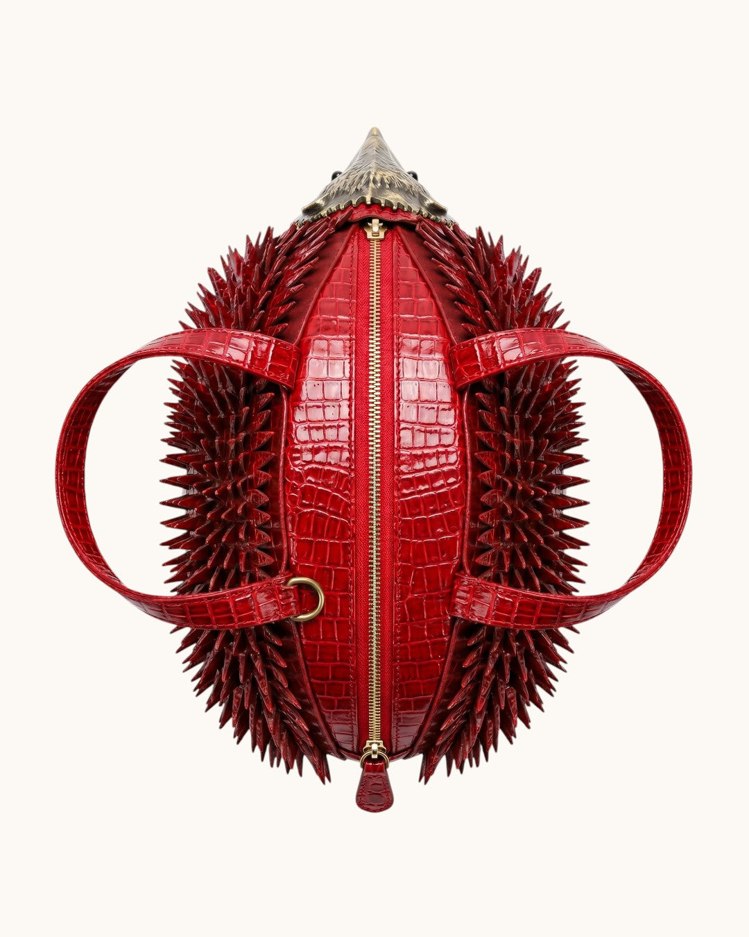Pine Drew India Épinelle Mini deep crimson croc-embossed vegan leather hedgehog bag with sculpted spines and gold zipper