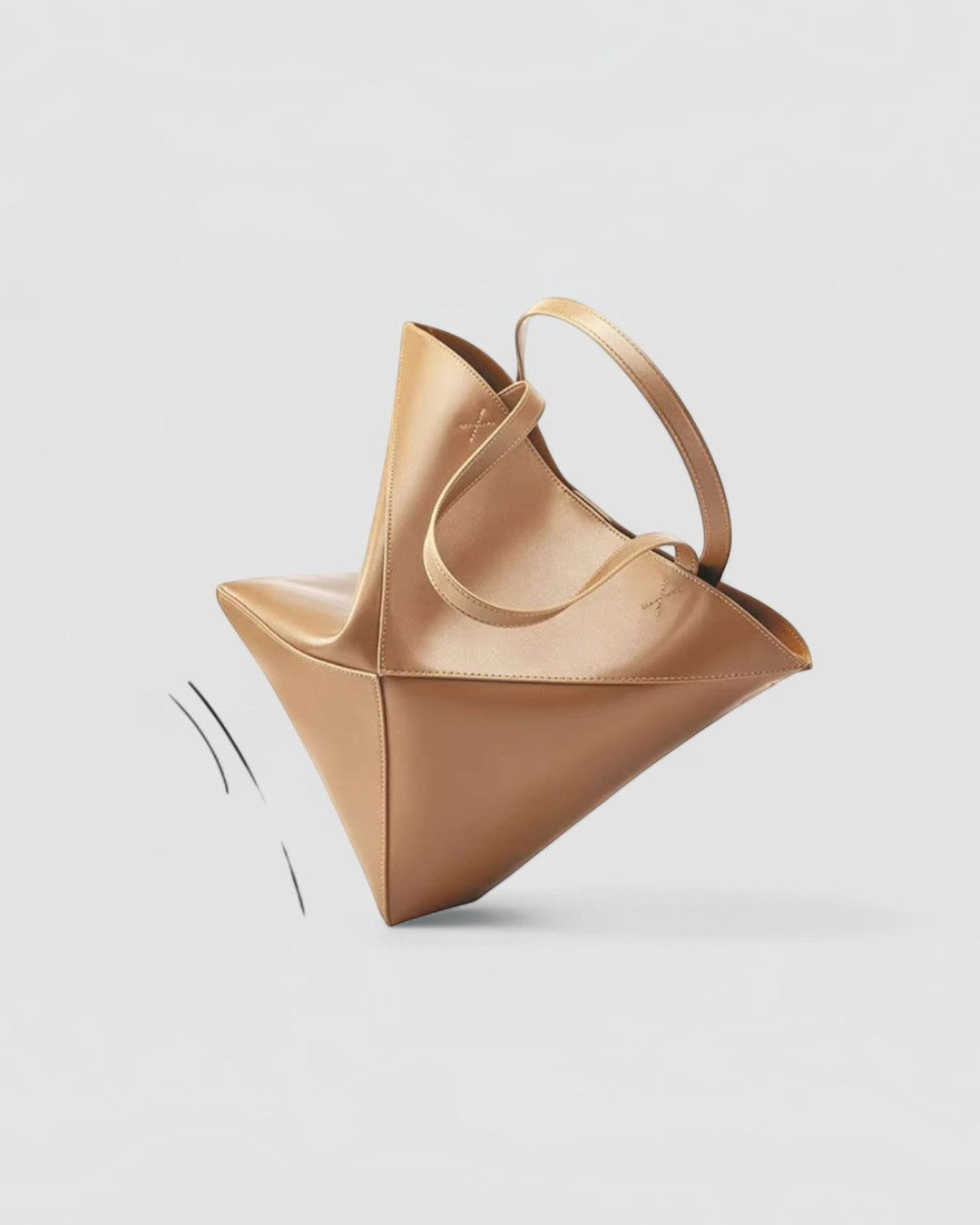 Pine Drew India EDA tote bag in warm tan full-grain leather with a geometric panel design and dual carry handles.