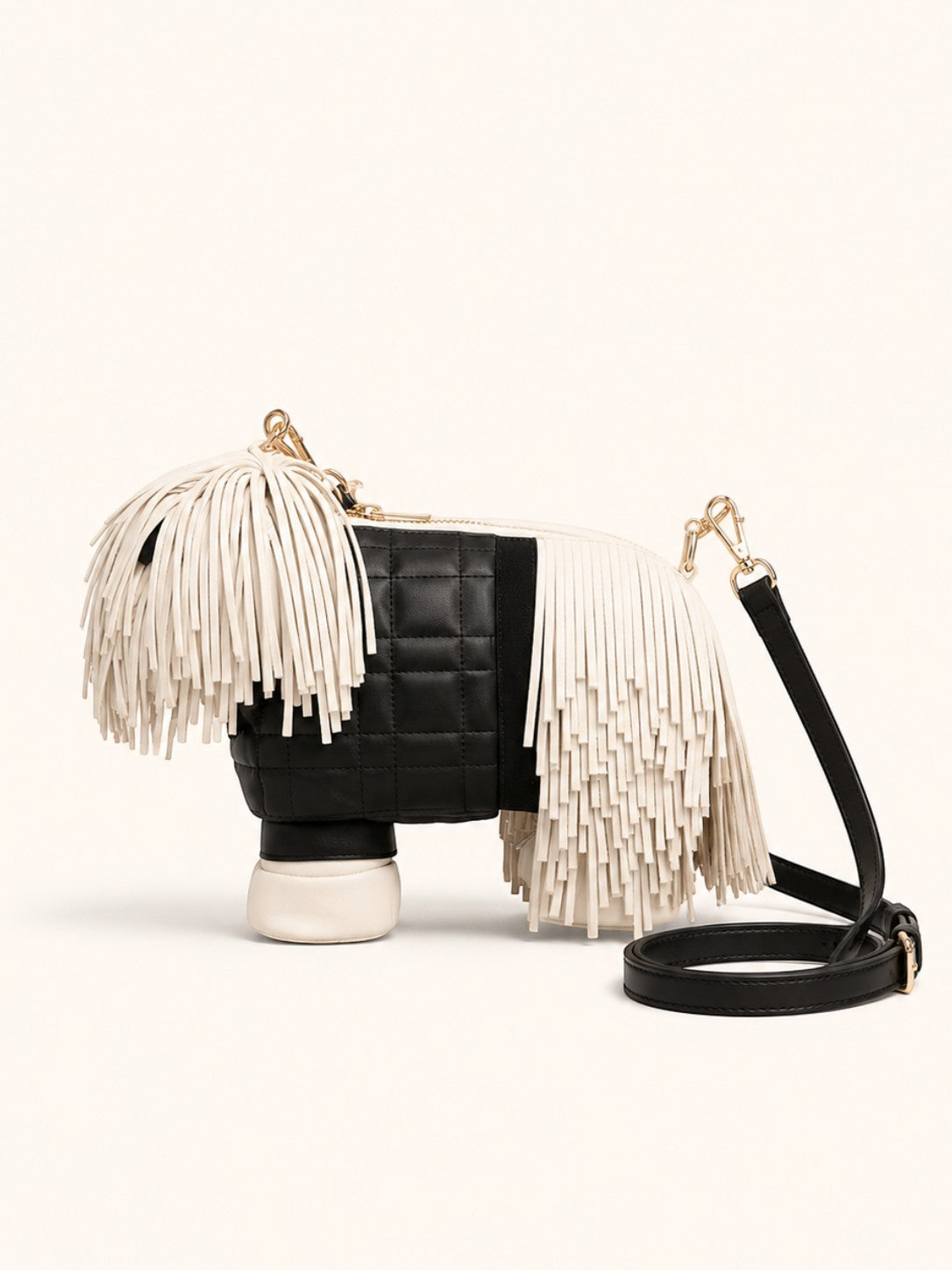 Pine Drew India Fringe Pup Couture Bag in black and white vegan leather with gold hardware and layered fringe detail.