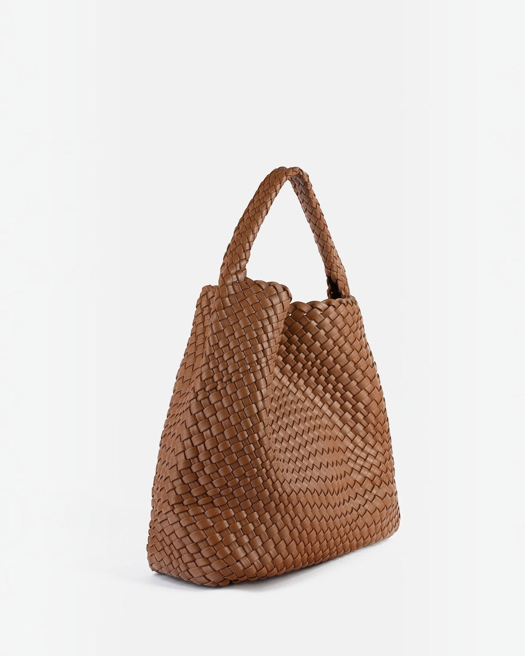 Pine Drew India The Jocelyn bag in brown handwoven vegan leather with a slouchy sculptural design and single handle.