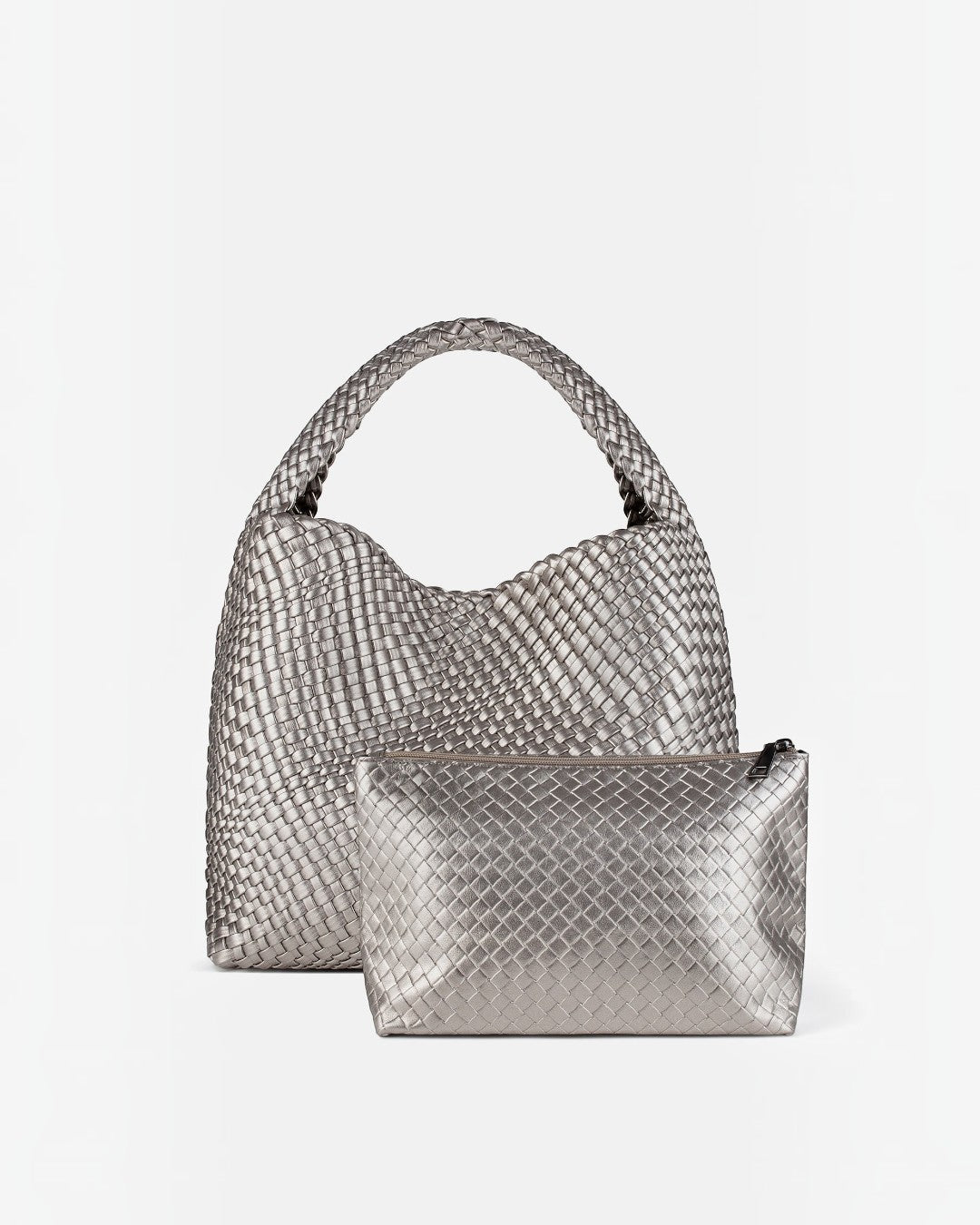 Pine Drew India The Jocelyn handwoven metallic silver vegan leather hobo bag with a matching zippered pouch.