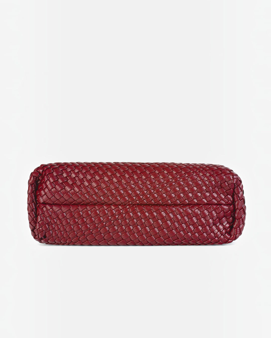 Pine Drew India The Jocelyn bag in deep red handwoven vegan leather showing the flat base for an upright hold.