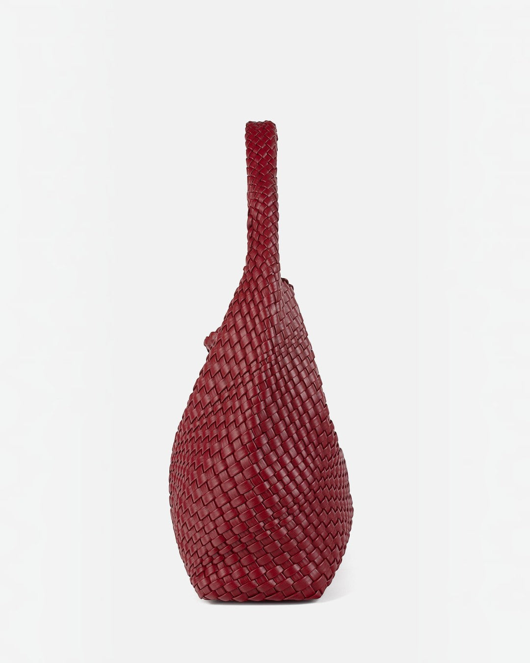 Pine Drew India The Jocelyn handwoven deep red vegan leather shoulder bag with a sculptural slouchy silhouette.