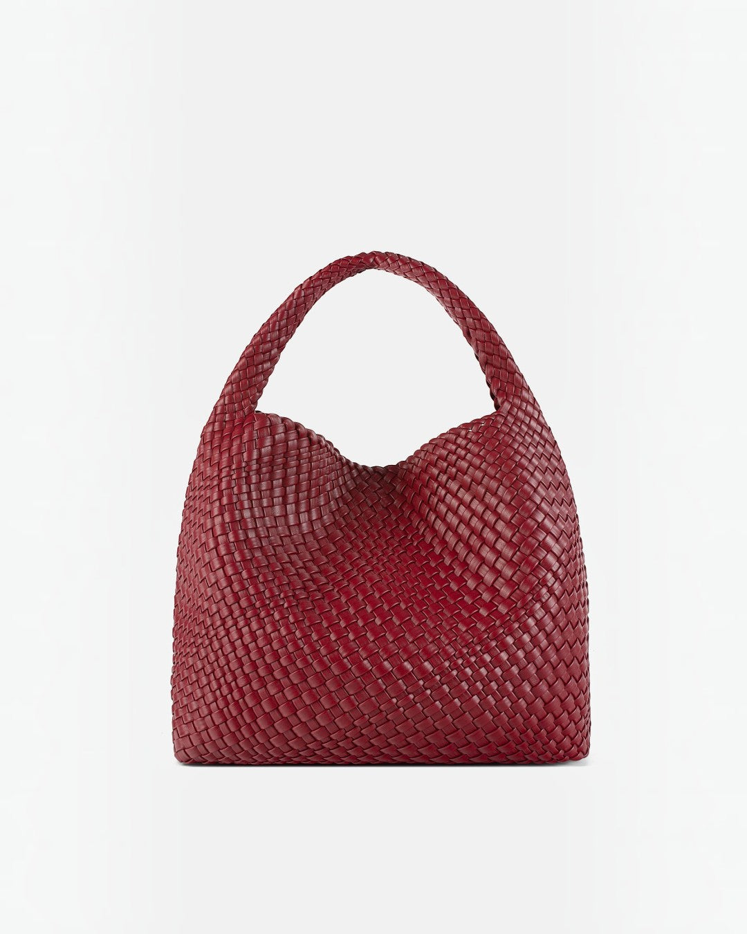 Pine Drew India The Jocelyn bag in deep red handwoven vegan leather with a slouchy sculptural silhouette.