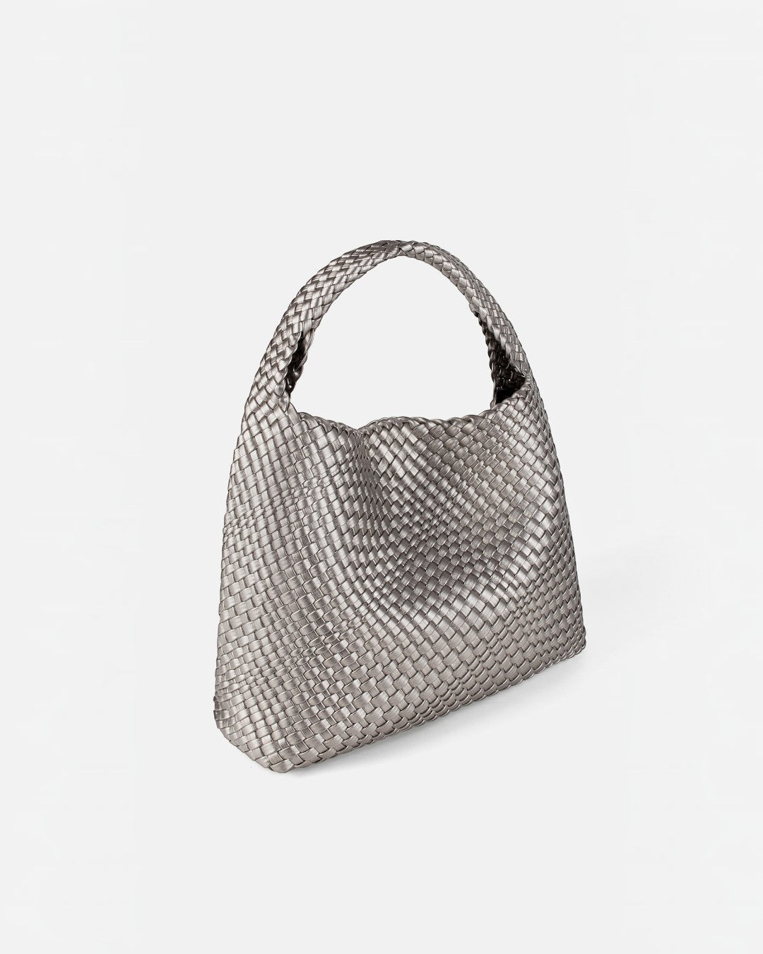 Pine Drew India The Jocelyn bag in metallic silver handwoven vegan leather with a slouchy sculptural silhouette.