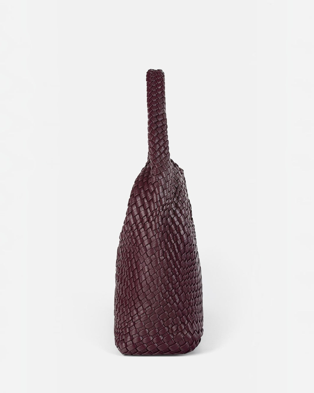 Pine Drew India The Jocelyn handwoven deep burgundy vegan leather shoulder bag with a slouchy sculptural silhouette.