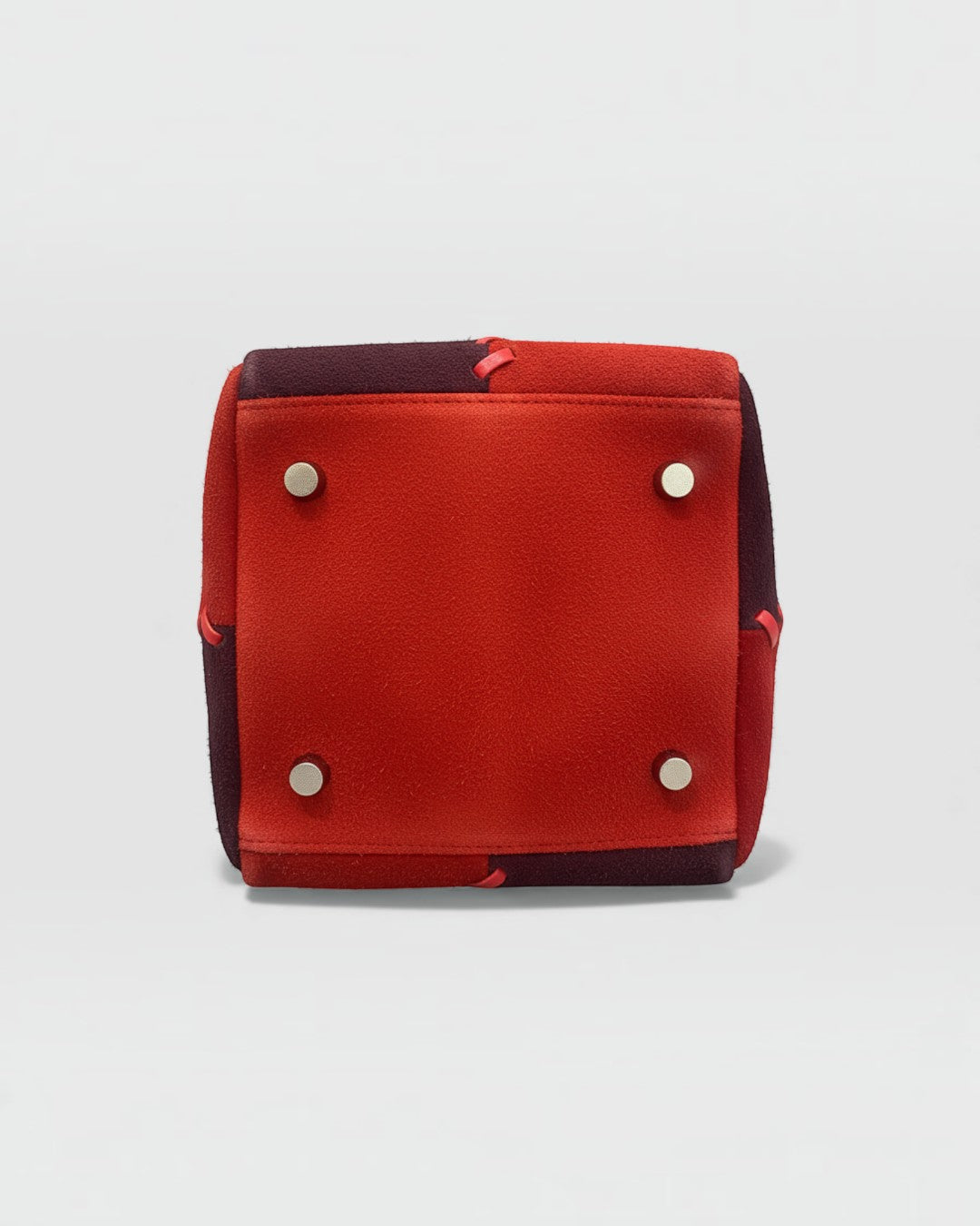 Pine Drew India Luna Mosaic handbag base featuring red and burgundy suede patchwork with four silver protective feet.