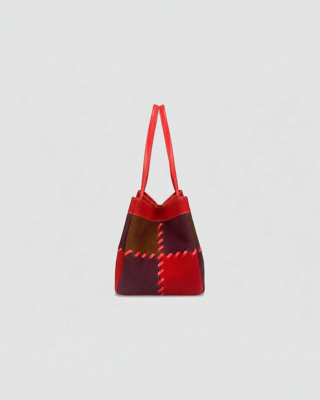 Pine Drew India Luna Mosaic handbag in multi-tone suede and leather with red contrast stitching and arc handles.