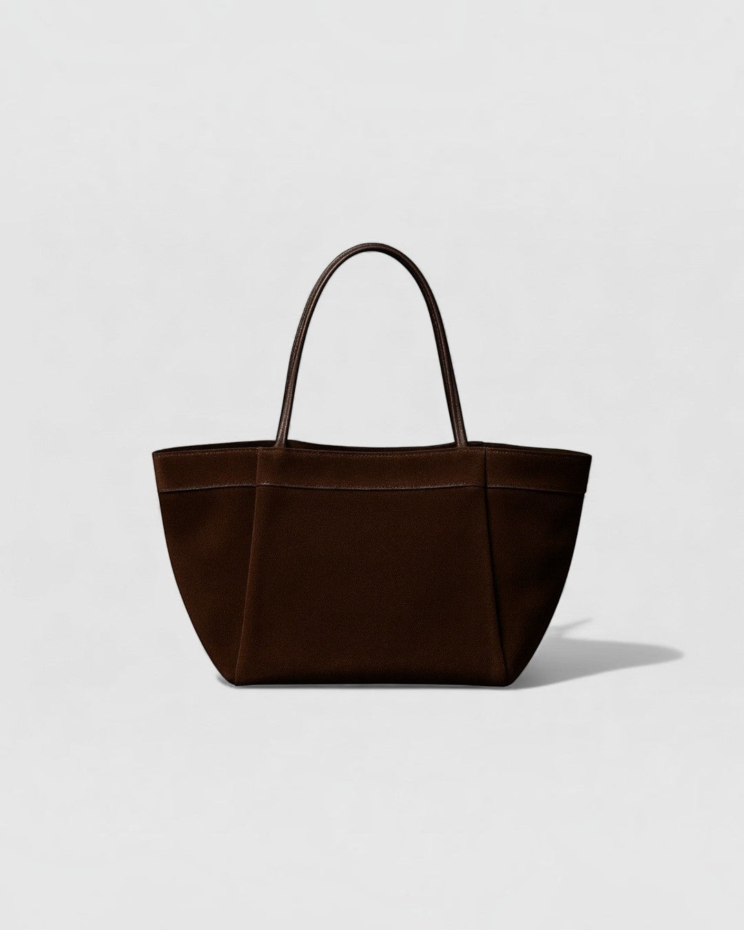 Pine Drew India Luna Umber handbag in suede-textured brown leather with architectural arc handles and structured base.