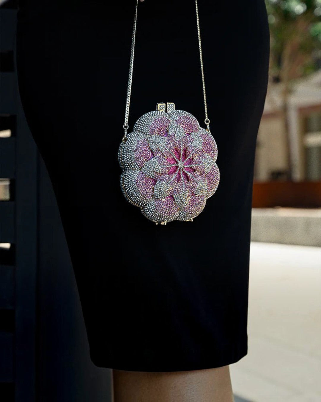 Pine Drew India pink floral clutch bag with sparkling rhinestone embellishments and a silver chain strap