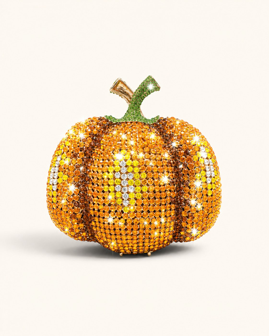 Pine Drew India pumpkin-shaped novelty clutch covered in sparkling orange and yellow crystals with a green stem.