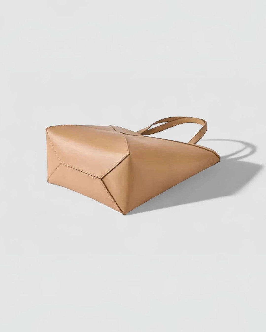 Pine Drew India The EDA Tote bag in tan full-grain leather with geometric panel construction and dual carry handles.