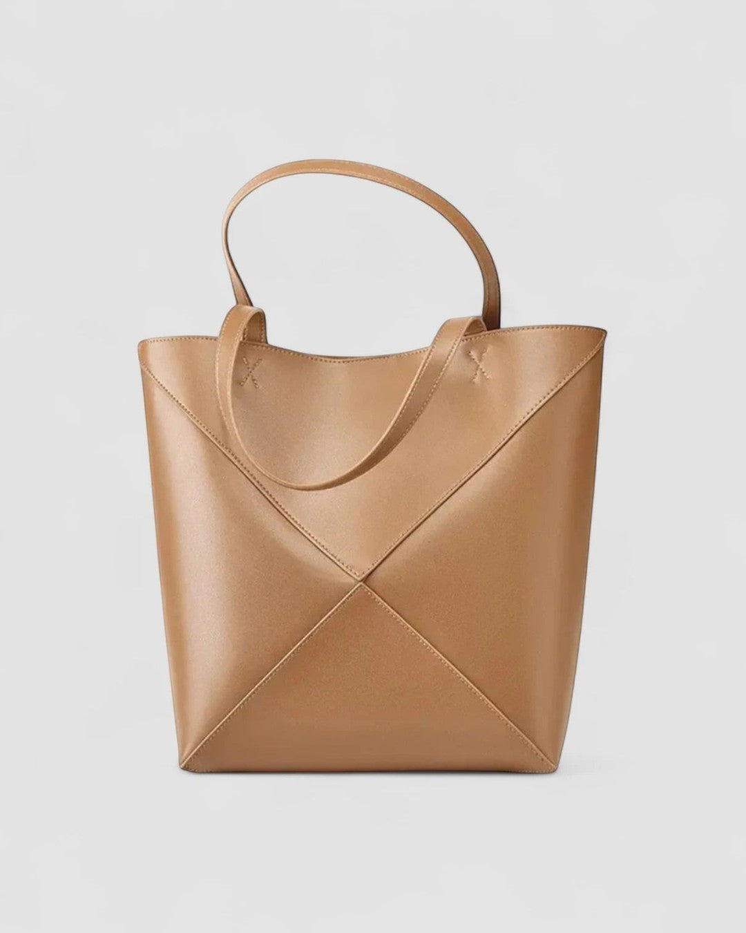 Pine Drew India The EDA Tote bag in tan full-grain leather with a geometric panel design and dual carry handles.